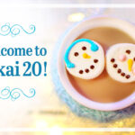 Welcome to Sakai 20 announcement next to cup of hot chocolate with snowman marshmallows